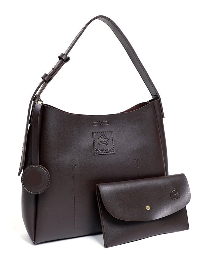 A brown vegan leather tote bag with a matching pouch, displayed against a white background.