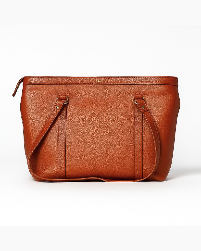 Tan leather handbag on a white background