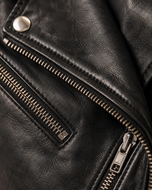 Alison — women's black leather biker jacket, close-up of the leather grain and hardware | Kordovan Pakistan