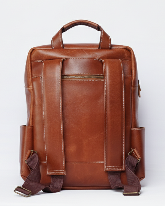 Brown leather backpack on a white background