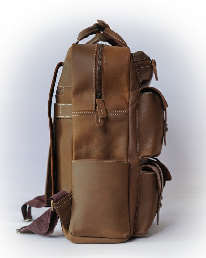 Brown leather backpack on a white background