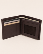 The Aristocrat wallet open — card and cash compartments in brown leather
