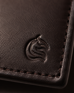 Close-up of the smooth brown leather grain on The Aristocrat wallet