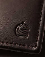 Close-up of the smooth brown leather grain on The Aristocrat wallet