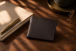 Brown Aristocrat slim wallet on a walnut desk — understated everyday carry by Kordovan