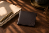 Brown Aristocrat slim wallet on a walnut desk — understated everyday carry by Kordovan