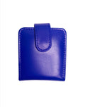A closed blue genuine leather lipstick case with a flap and a magnetic button on the front.