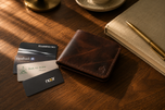 Bronco Crazy Horse leather wallet resting on a walnut desk — rugged everyday carry by Kordovan