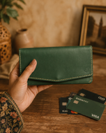 Green Cleopatra full-grain leather ladies wallet held in hand