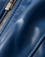 Cobalt — men's blue leather bomber jacket, close-up of the leather grain and hardware | Kordovan Pakistan