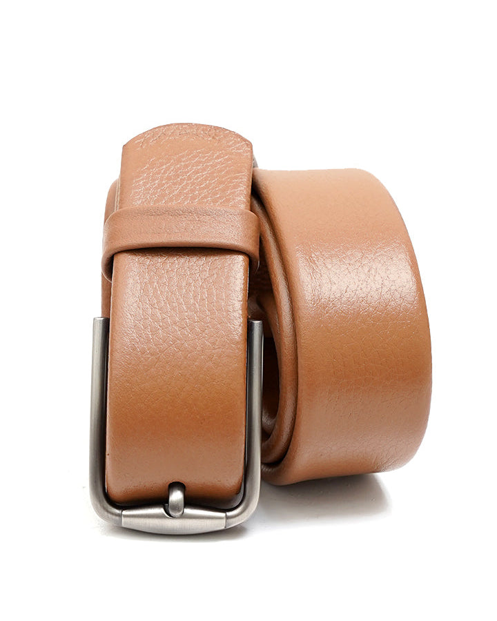 A brown, premium cow leather belt with a metal buckle, displayed in a coiled fashion.