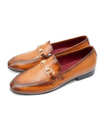 A pair of brown LIONEL Loafer Moccasin shoes for men, featuring a metal chain link detail on the vamp.