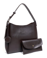 A brown vegan leather tote bag with a matching pouch, displayed against a white background.