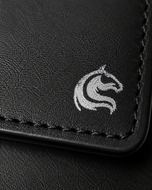 Close-up of the burnished black cow leather grain on the Elite Card Holder
