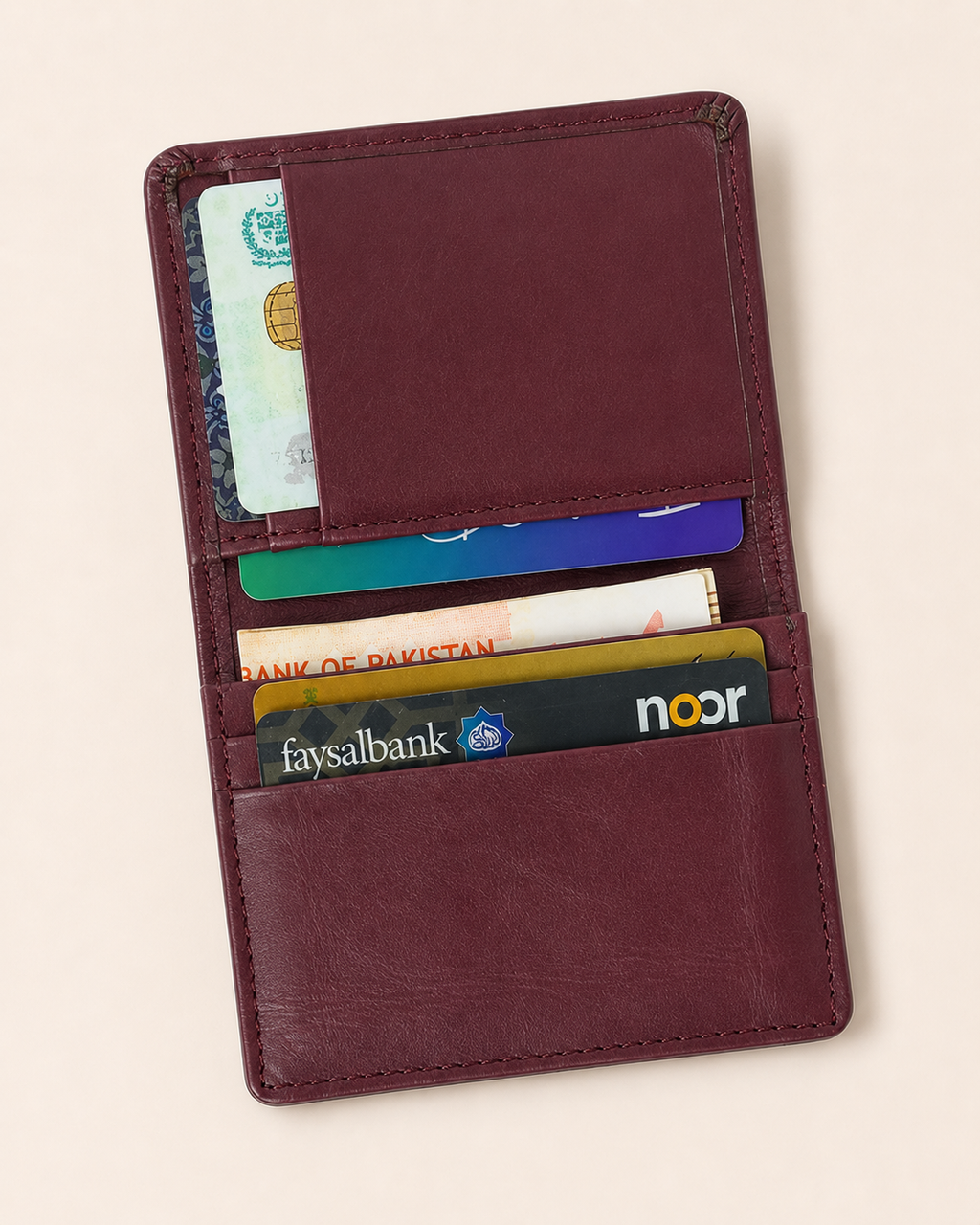 Burgundy Elite Card Holder open — inner flap pockets and quick-access pockets