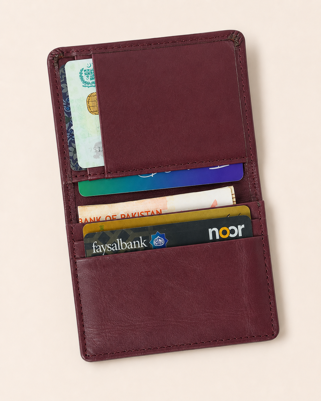 Burgundy Elite Card Holder open — inner flap pockets and quick-access pockets