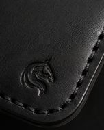 Close-up of the hand-stitched black cow leather on HM The Lord's Wallet