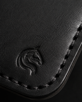 Close-up of the hand-stitched black cow leather on HM The Lord's Wallet