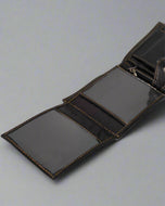 Sheppard wallet button pocket open — soft sheep leather detail