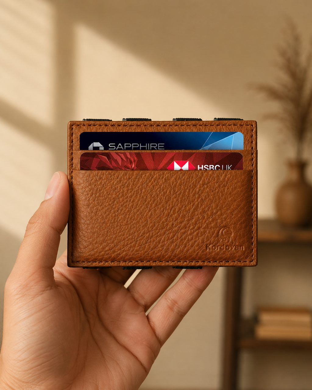 Camel ILLUSION magic wallet held in hand, showing its compact 3.8 by 2.9 inch size