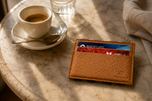 Camel ILLUSION magic wallet on a café table — slim leather carry by Kordovan