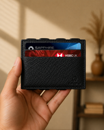 Black ILLUSION magic wallet held in hand, slim profile visible