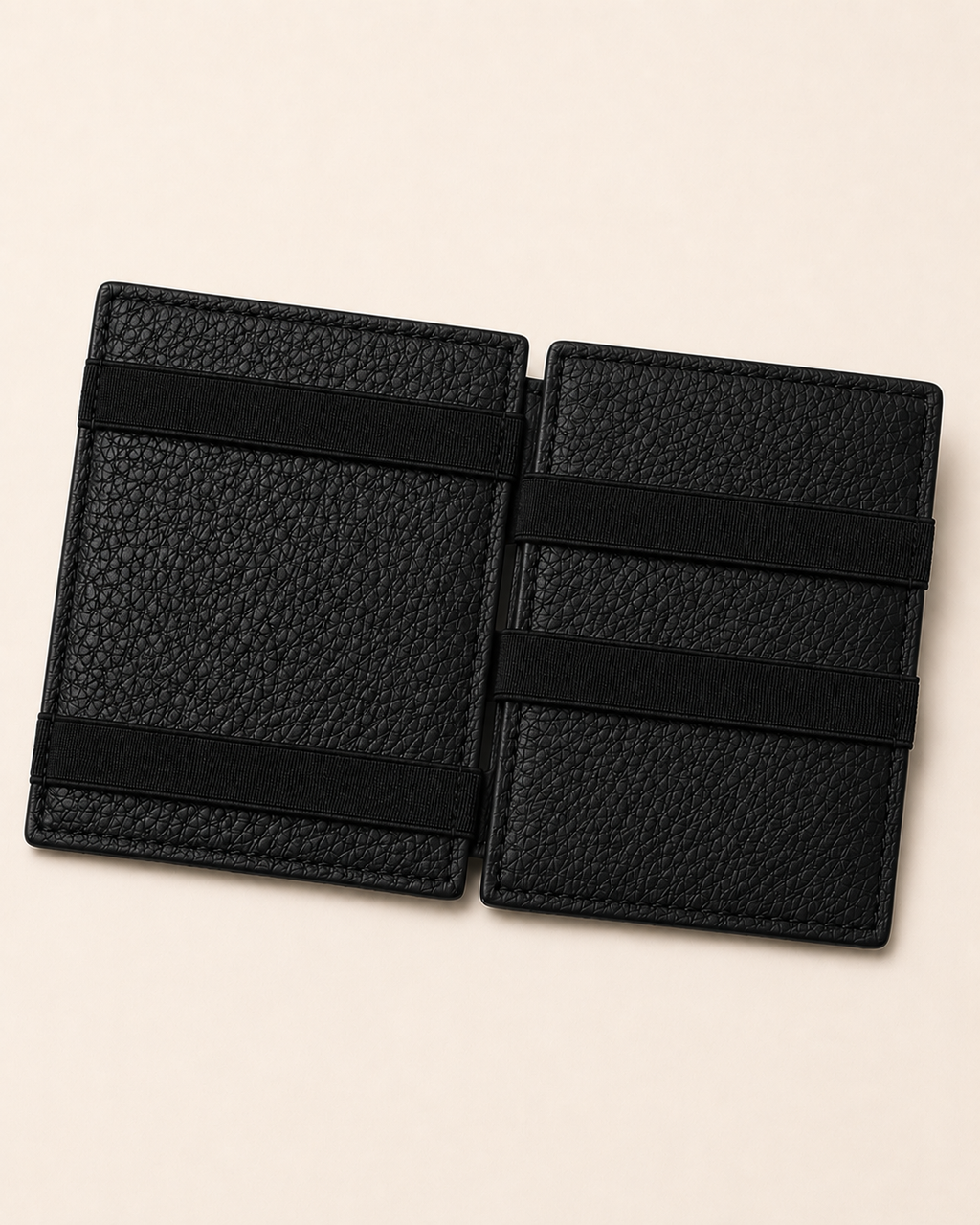 Black ILLUSION magic wallet open — crossed elastic holding notes, cards in their slots