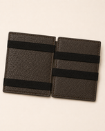 Grey ILLUSION magic wallet open — elastic cash grip and four card slots