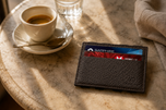Elephant grey ILLUSION magic wallet styled on a desk — Kordovan leather goods