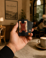 Black and brown Razor slim RFID wallet held in hand