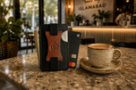 Black and brown Razor RFID wallet on a desk — Kordovan smart wallet