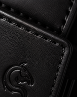 Black Kodo Vertical 2.0 open — cards rising on the pull strap, suede-lined interior
