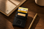 Black Kodo Vertical 2.0 RFID leather wallet on a walnut desk — Kordovan smart carry
