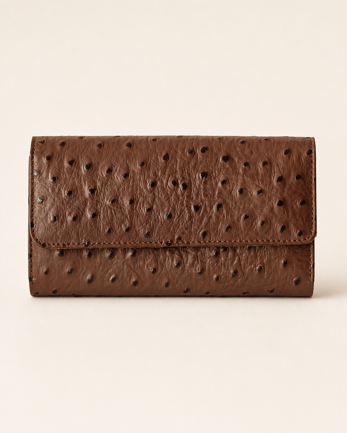 Luxurious ladies clutch wallet in chocolate brown ostrich-pattern leather — front view | Kordovan Pakistan