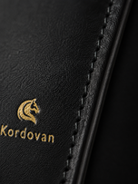 Close-up of the Midnight Black nappa leather texture on The Elite mobile wallet
