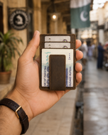 Crazy horse Money Clip wallet held in hand, showing slim profile