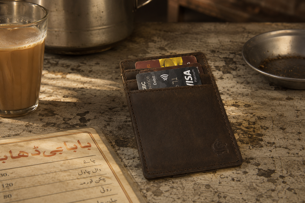 Crazy horse Money Clip leather wallet on a walnut desk — Kordovan