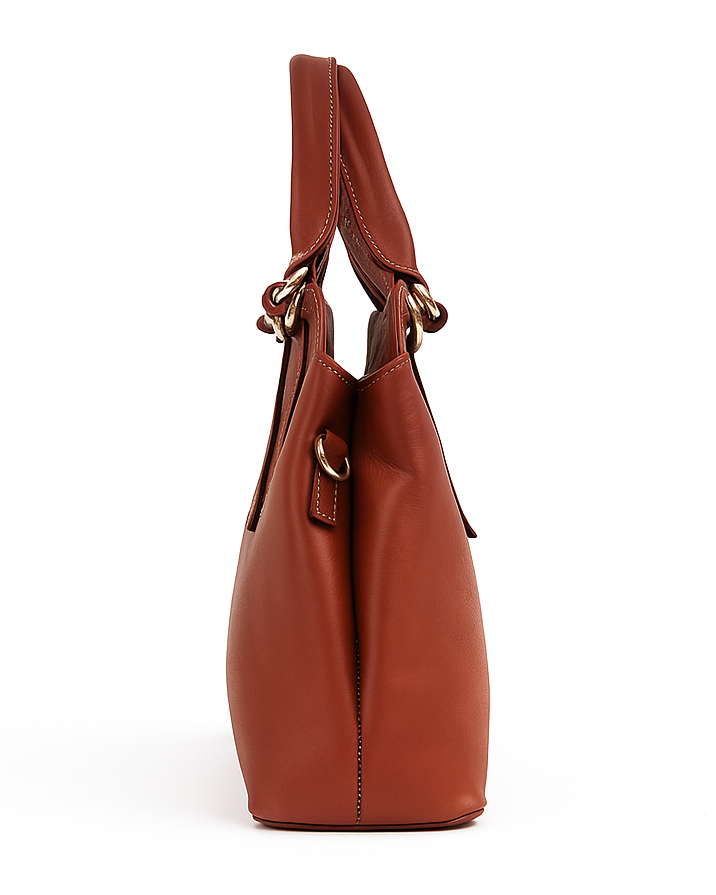Brown leather handbag on a white background
