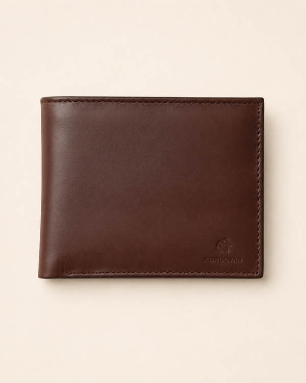 Plain bifold nappa leather wallet in tan — front view with embossed Kordovan mark | Pakistan