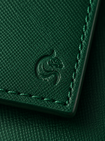 Close-up of the matte cross-hatched saffiano leather on the emerald green Kordovan wallet