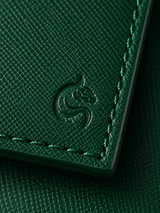 Close-up of the matte cross-hatched saffiano leather on the emerald green Kordovan wallet