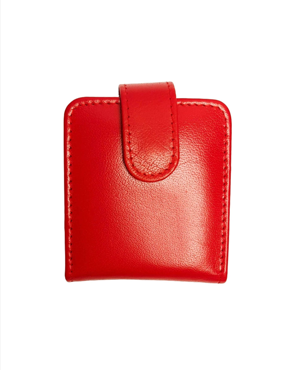 A closed red genuine leather lipstick case with a flap and a magnetic button on the front.