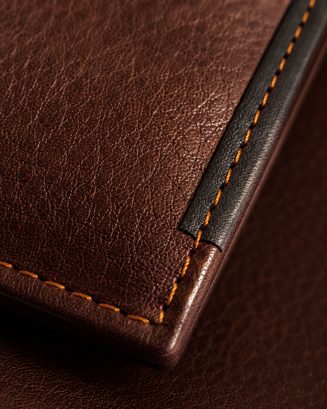Close-up of the soft milled cow leather grain and topstitching on the Shelby wallet