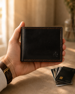 Sheppard sheep leather wallet held in hand, showing slim soft profile
