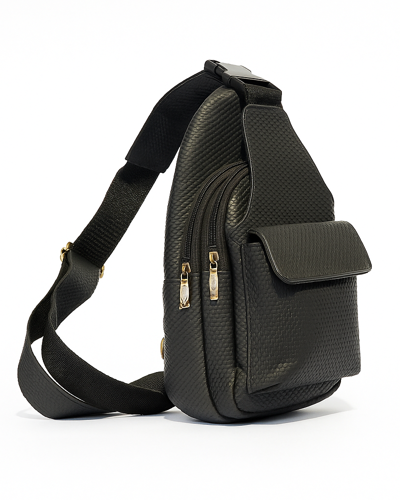 Black sling bag with gold zippers on a white background