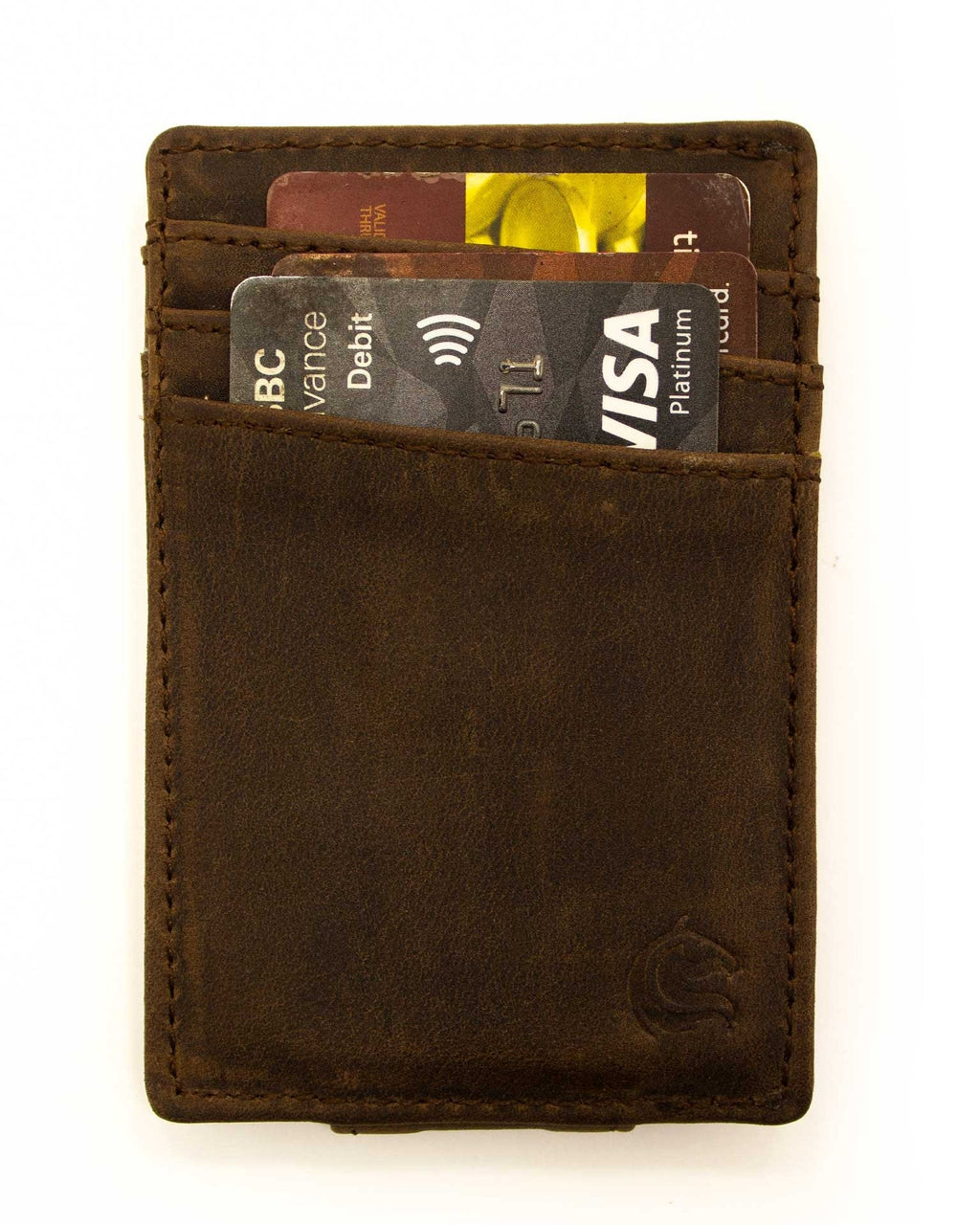 A brown leather money clip wallet with cards and a bill slotted in the center.