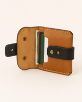 The Hunter HM wallet open — card slots and hidden cash pocket in genuine cow leather
