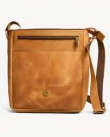 Brown leather crossbody bag on a white background