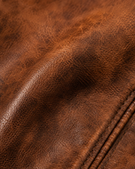 The Waxed Rider — men's brown waxed sheepskin cafe racer leather jacket, close-up of the waxed leather grain | Kordovan Pakistan