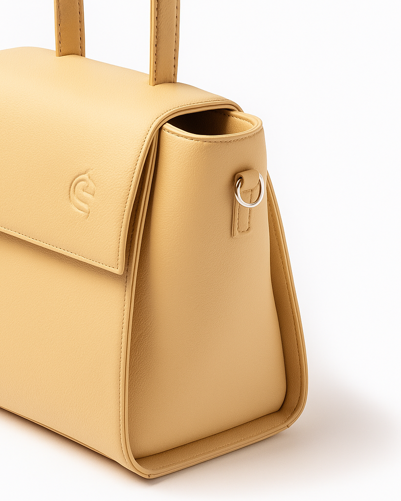 Yellow handbag with a visible brand logo on a white background